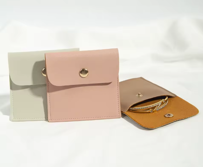 100pcs Wholesale Custom Faux Leather Jewelry Pouches with Embossed Logo – Snap Button Gift Bags for Rings, Earrings, Bracelets & Necklace Packaging