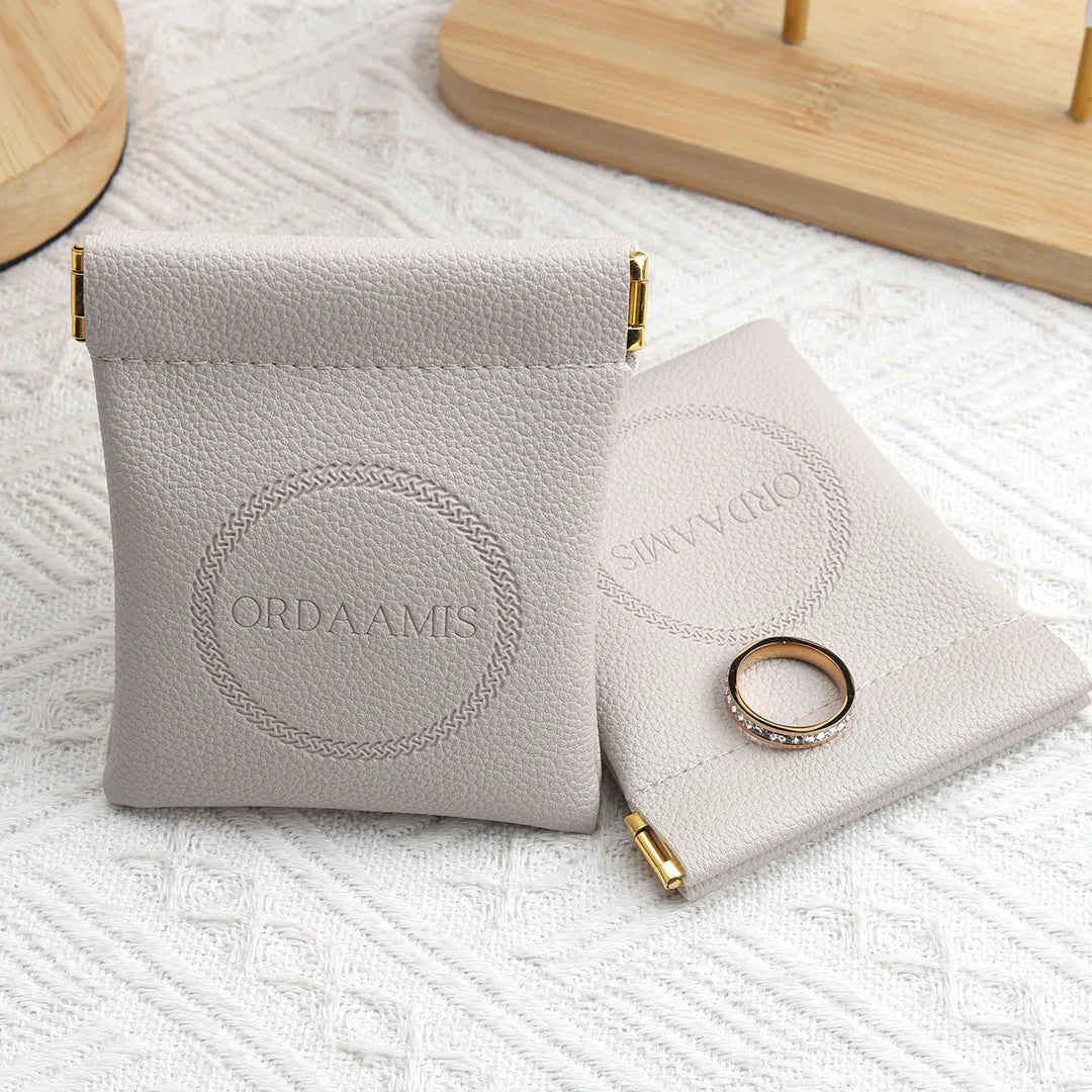 100pcs Wholesale Luxury PU Leather Magnetic Jewelry Pouches – Custom Embossed Logo Boutique Packaging for Rings & Necklaces