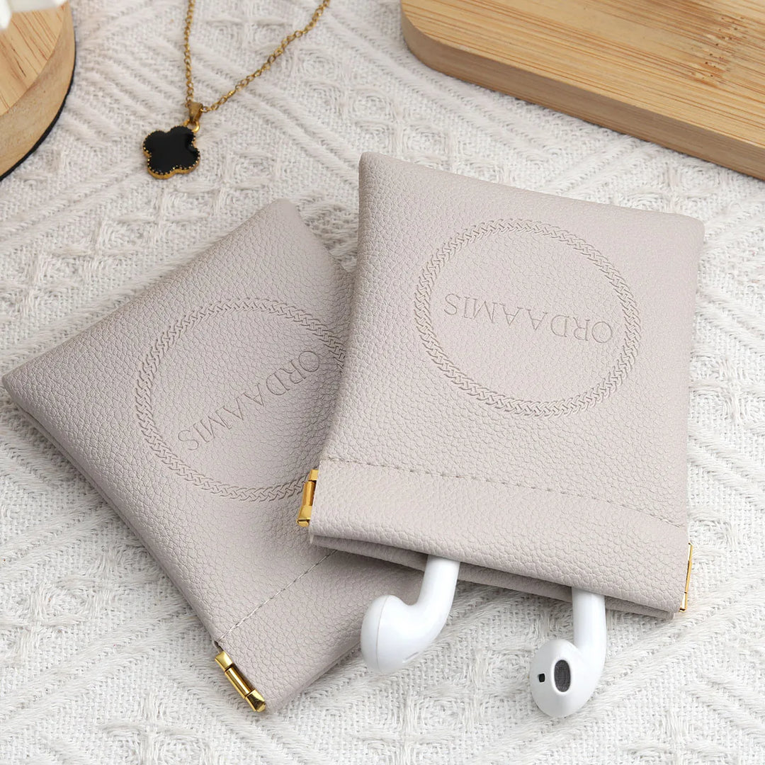 100pcs Wholesale Luxury PU Leather Magnetic Jewelry Pouches – Custom Embossed Logo Boutique Packaging for Rings & Necklaces
