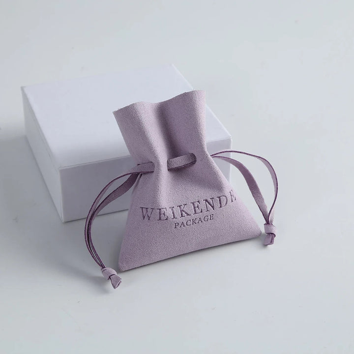 Custom Microfiber Drawstring Jewelry Pouch with Logo – Unique Gift Bag Shape with Debossed Logo for Earrings, Necklaces & Gifting, Wholesale