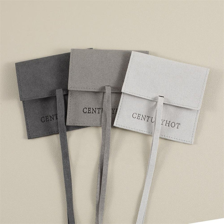 100pcs Custom Microfiber Jewelry Pouch – Envelope-Style with Strap Closure & Custom Logo for Rings, Earrings & Necklaces Wholesale